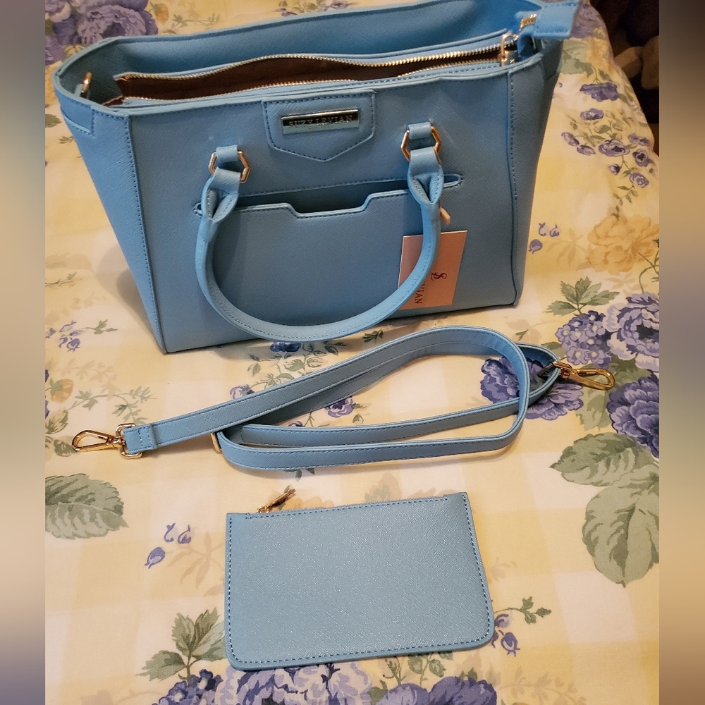 Suzy Levian Handbag in Light Blue color. Brand New. Still with tag.